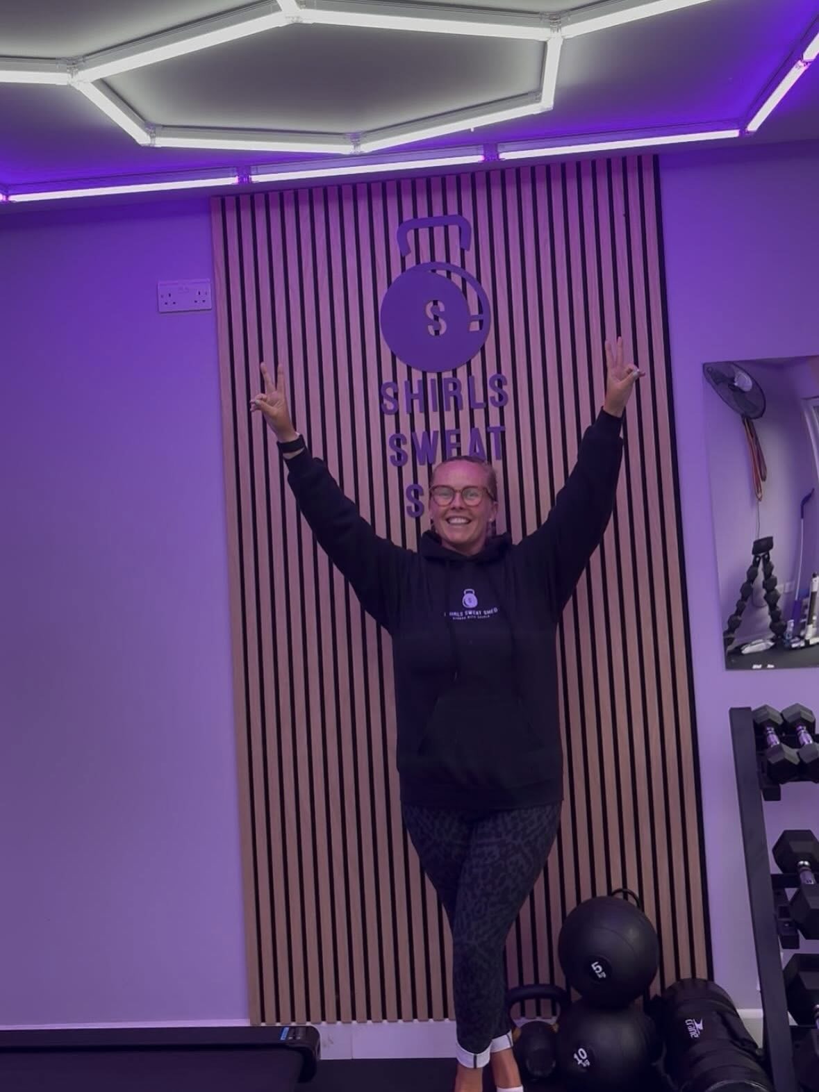 Coach in The Shed by the Shirls logo wall